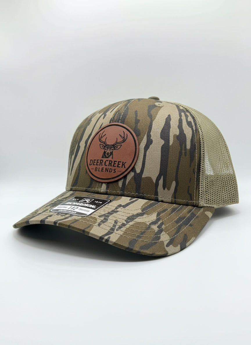 OG Logo Leather Patch Trucker Hat- Mossy Oak Bottomland™